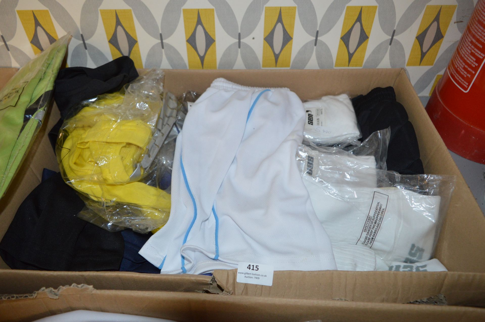 Box Containing a Quantity of Sports Tops