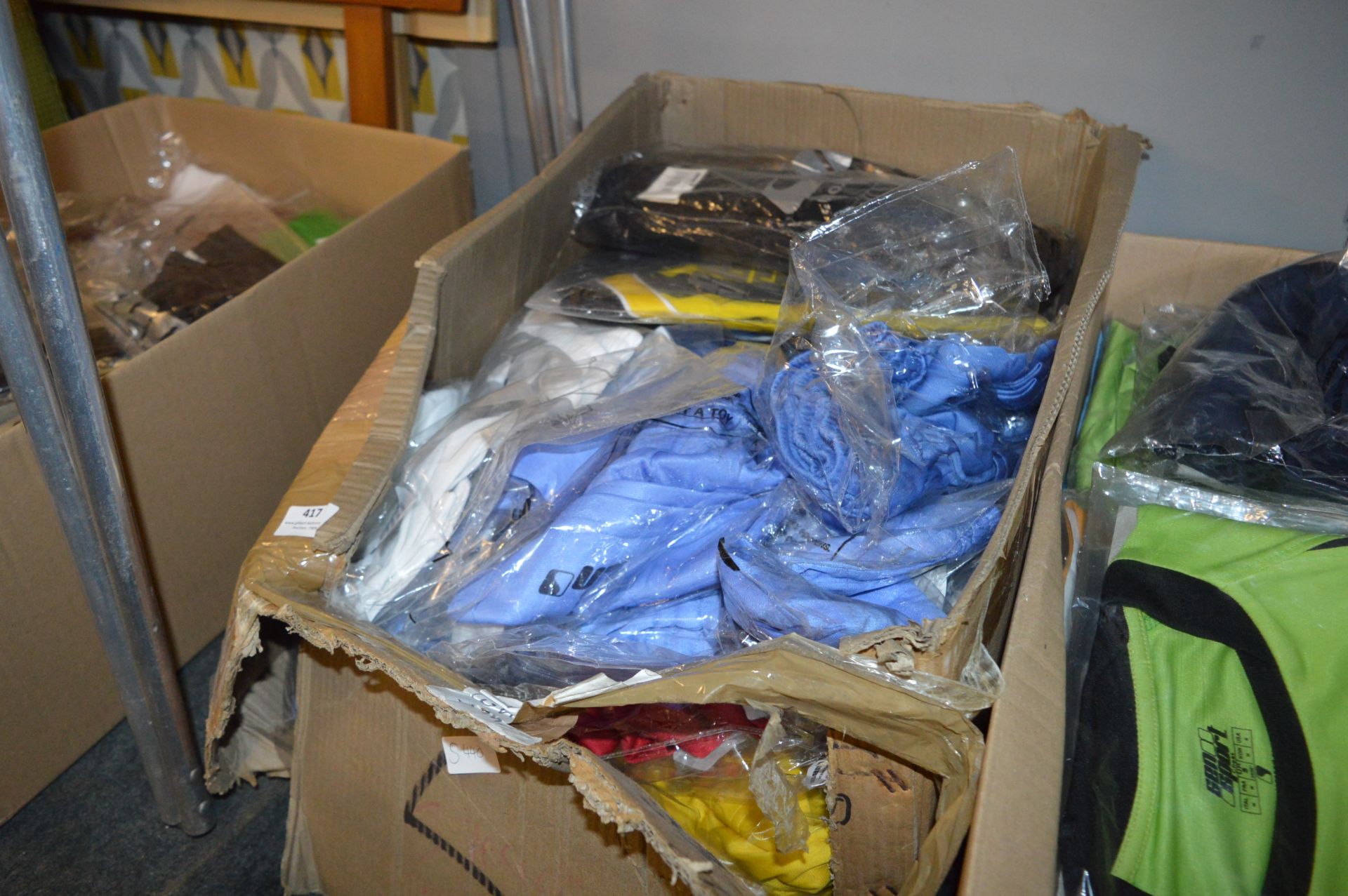 Box Containing a Quantity of Sports Tops