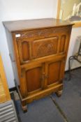 Oak Drinks Cabinet with Carved Panel Doors