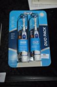 *Two Oral-B Toothbrushes