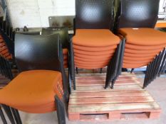Twenty Five Orange Banqueting Chairs with Black Pl