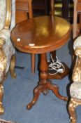Mahogany Oval Topped Pedestal Tip Table