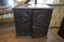 Oak Smokers Cabinet with Carved Panel Doors