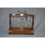 Oak and Plate Mounted Three Bottle Tantalus