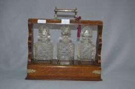 Oak and Plate Mounted Three Bottle Tantalus