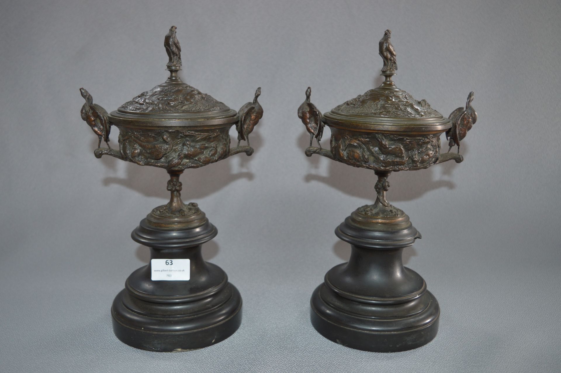 Pair of Bronze Coupe Aux Cigognes Covered Urns by