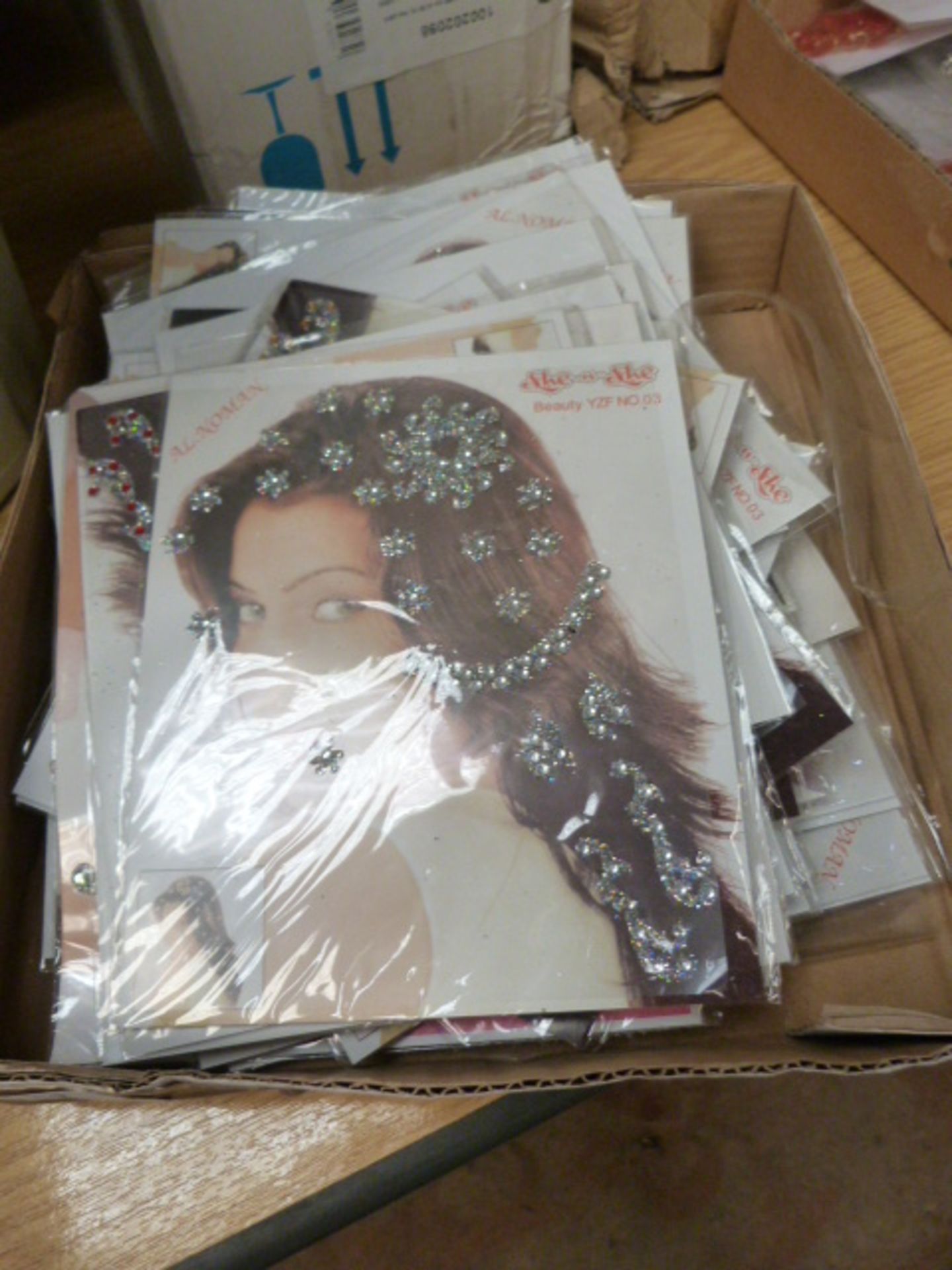 Box Containing She-n-She Self Adhesive Hair Gems