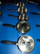 Five Assorted Stainless Steel Pans and Two Lids