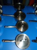 Four Stainless Steel Graduating Pans with Lids