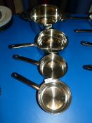 Four Stainless Steel Graduating Pans