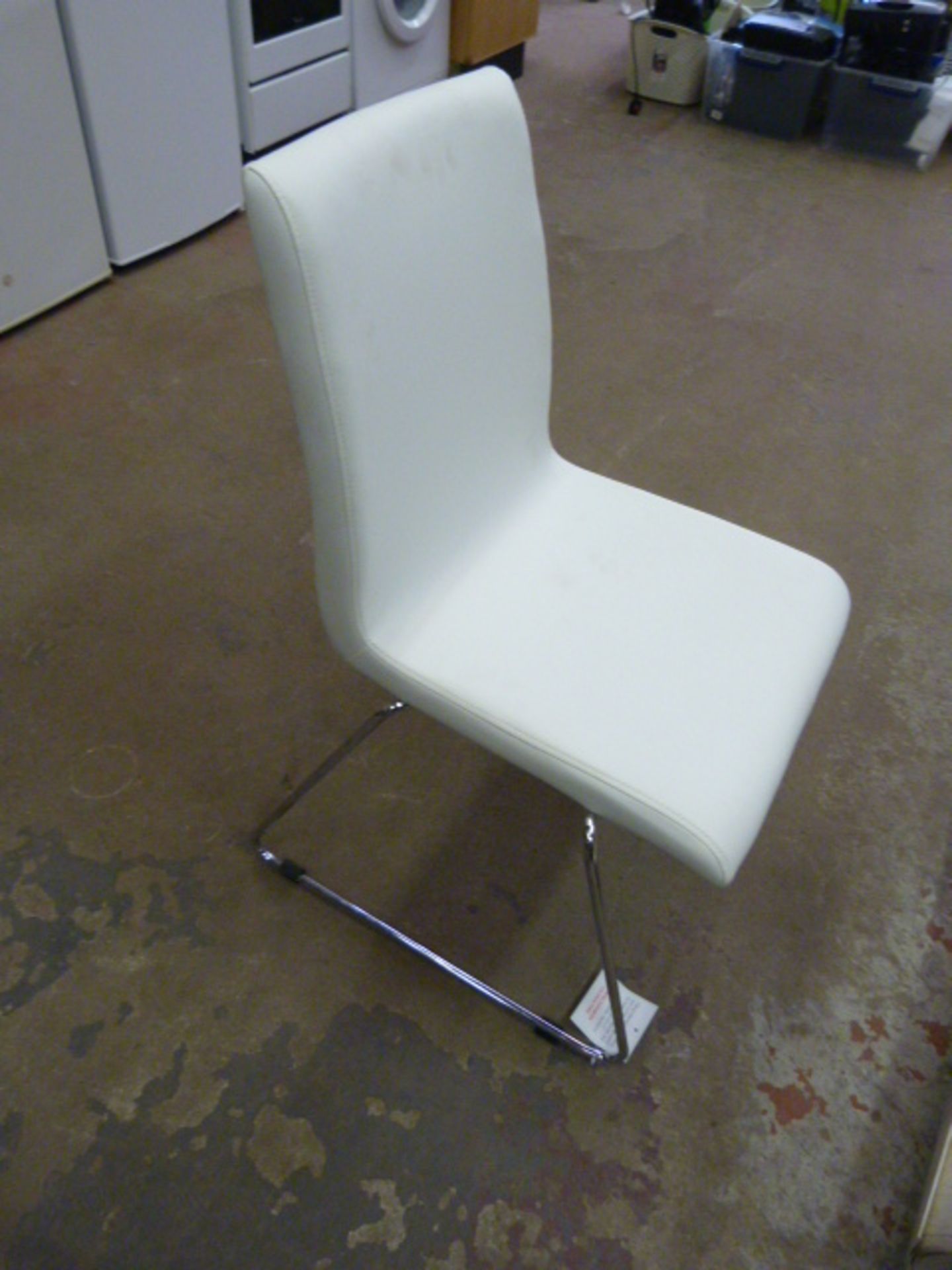 *Four White Polyurethane Chairs