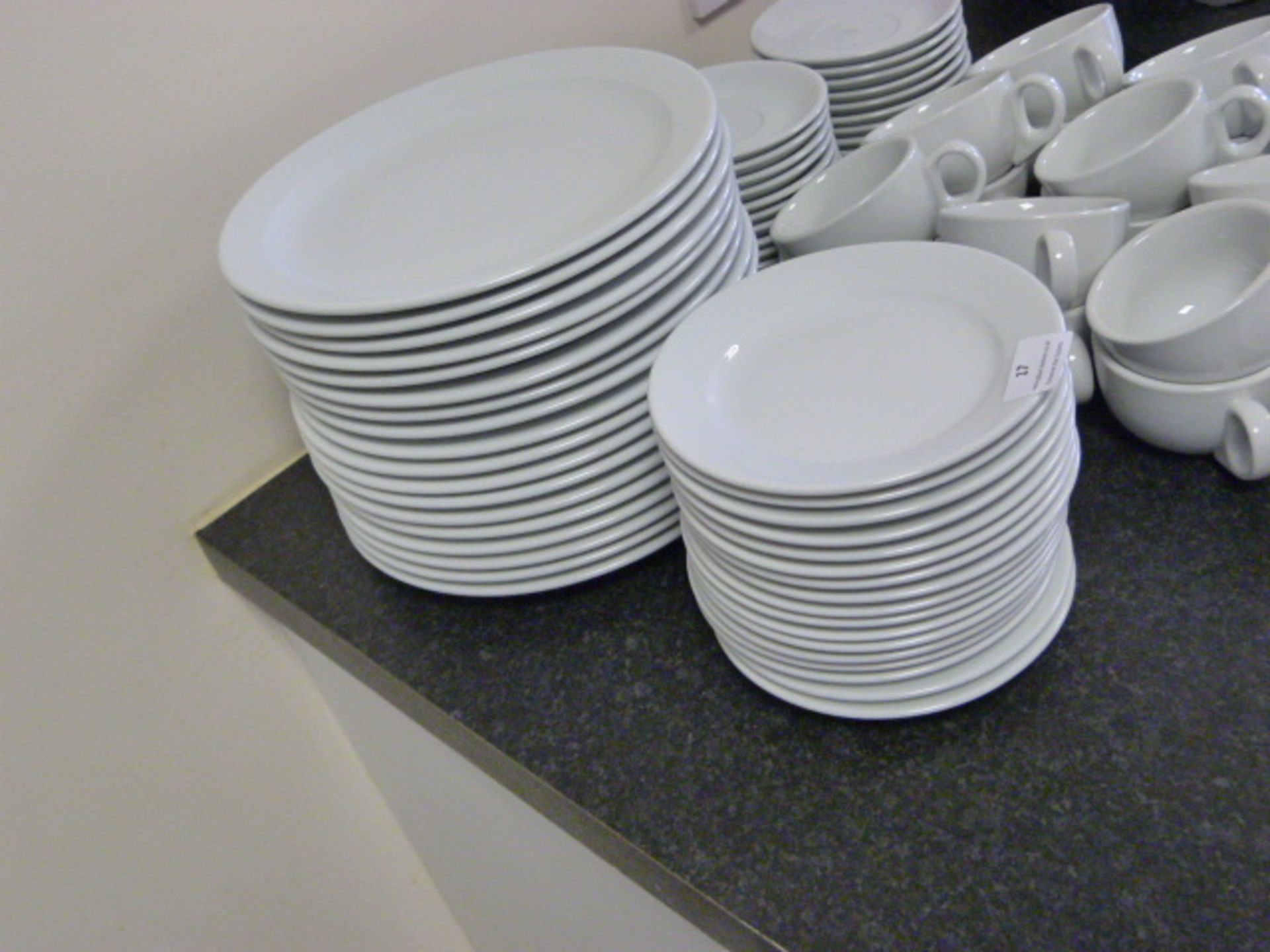 *Eighteen Dinner Plates and Seventeen Side Plates