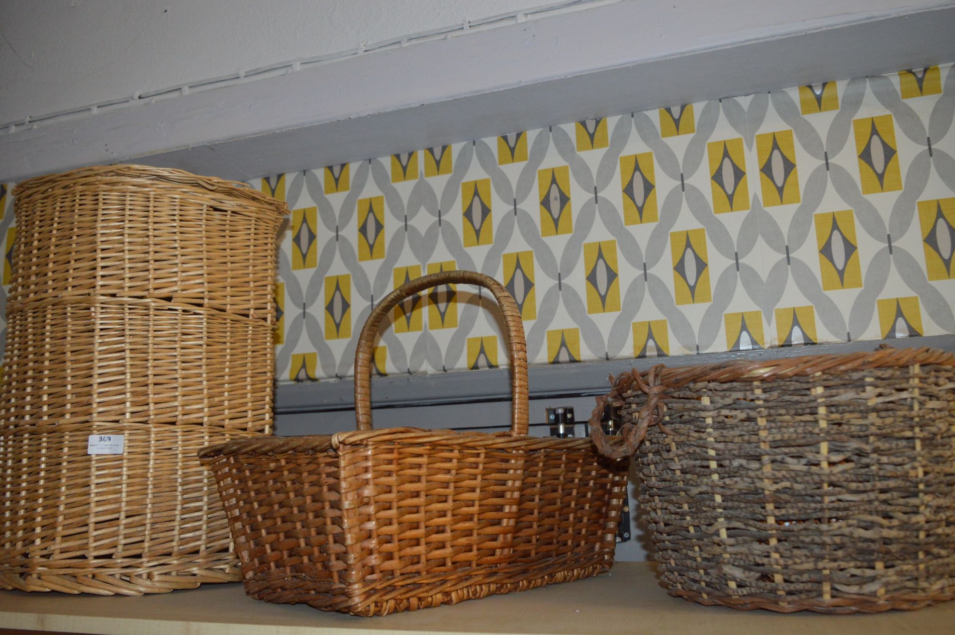 Two Cane Baskets and a Laundry Basket