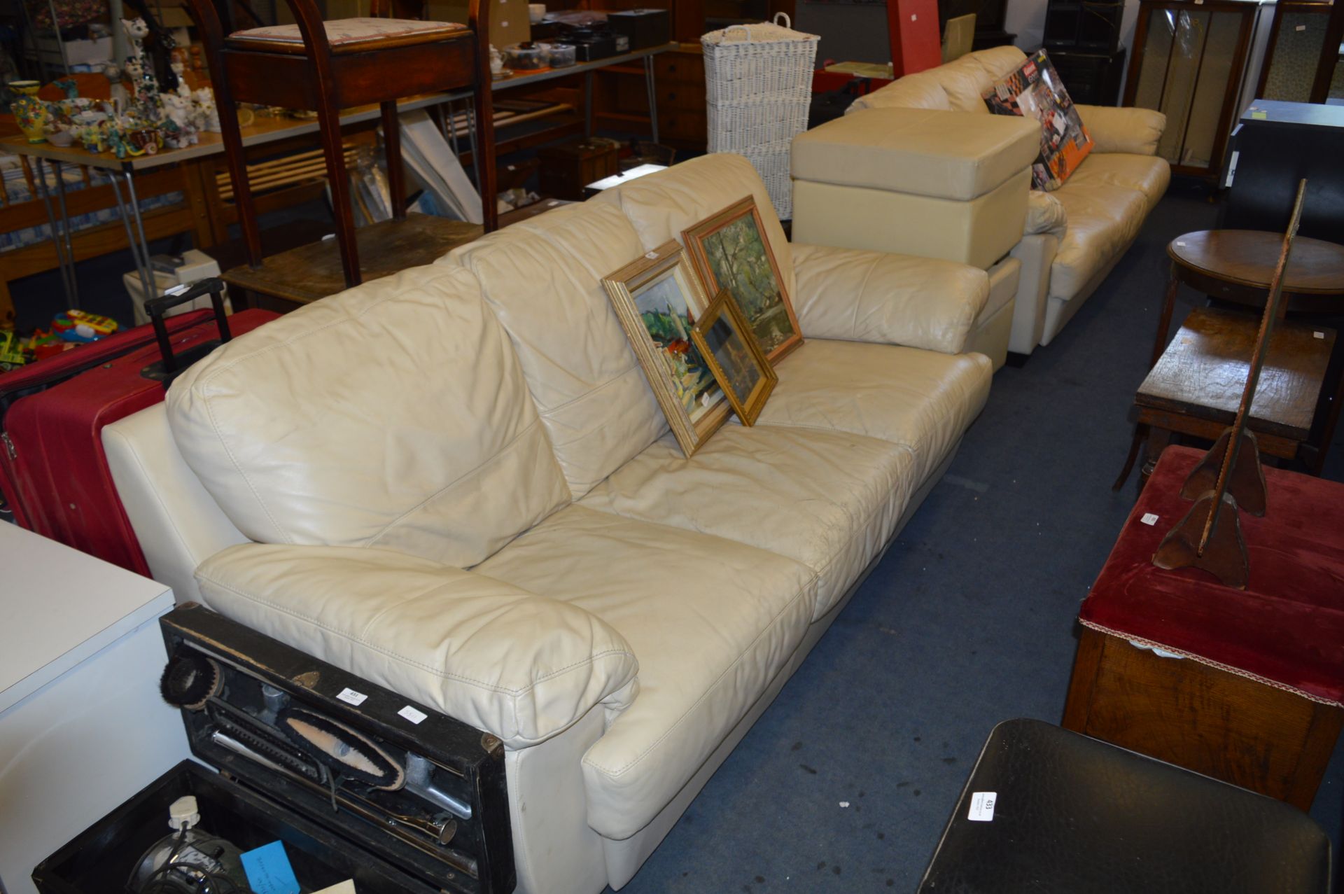 Two Cream Leather Three Seat Sofas with Pouffe Sto