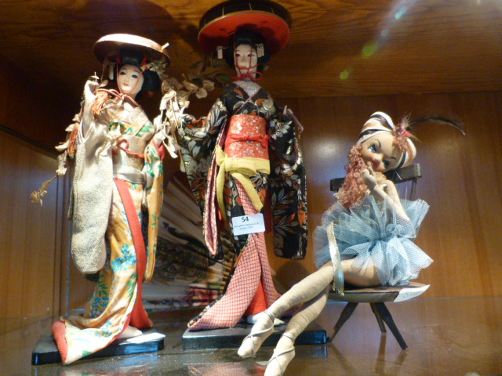 Two Decorative Geisha Girl Dolls and a Another