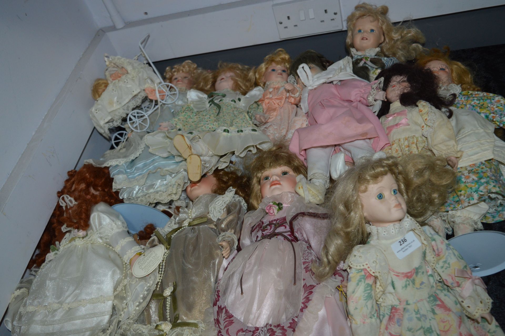 Large Collection of Porcelain Headed Dolls