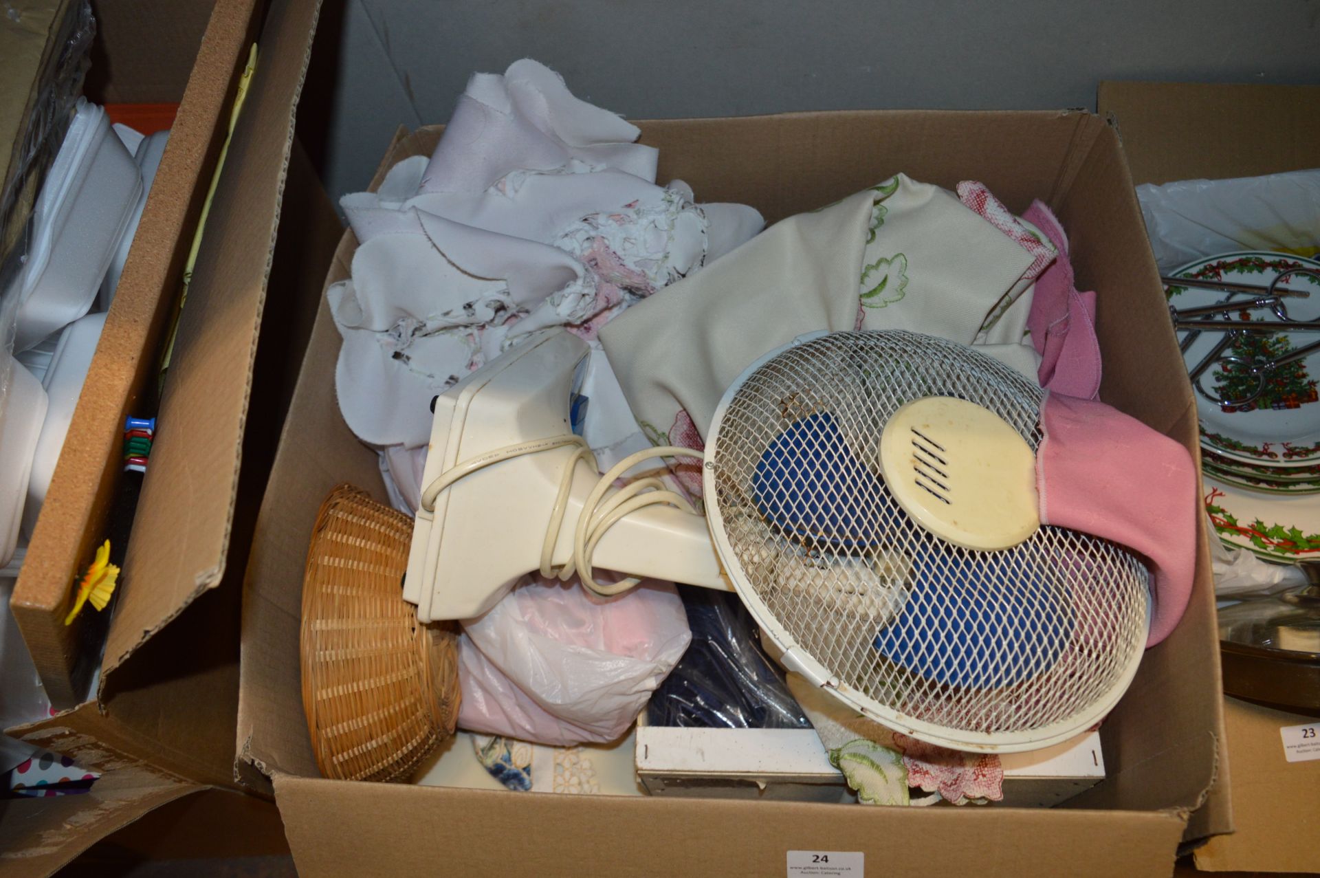 Box Containing Table Cloths, Pan Lids, Fan, etc.