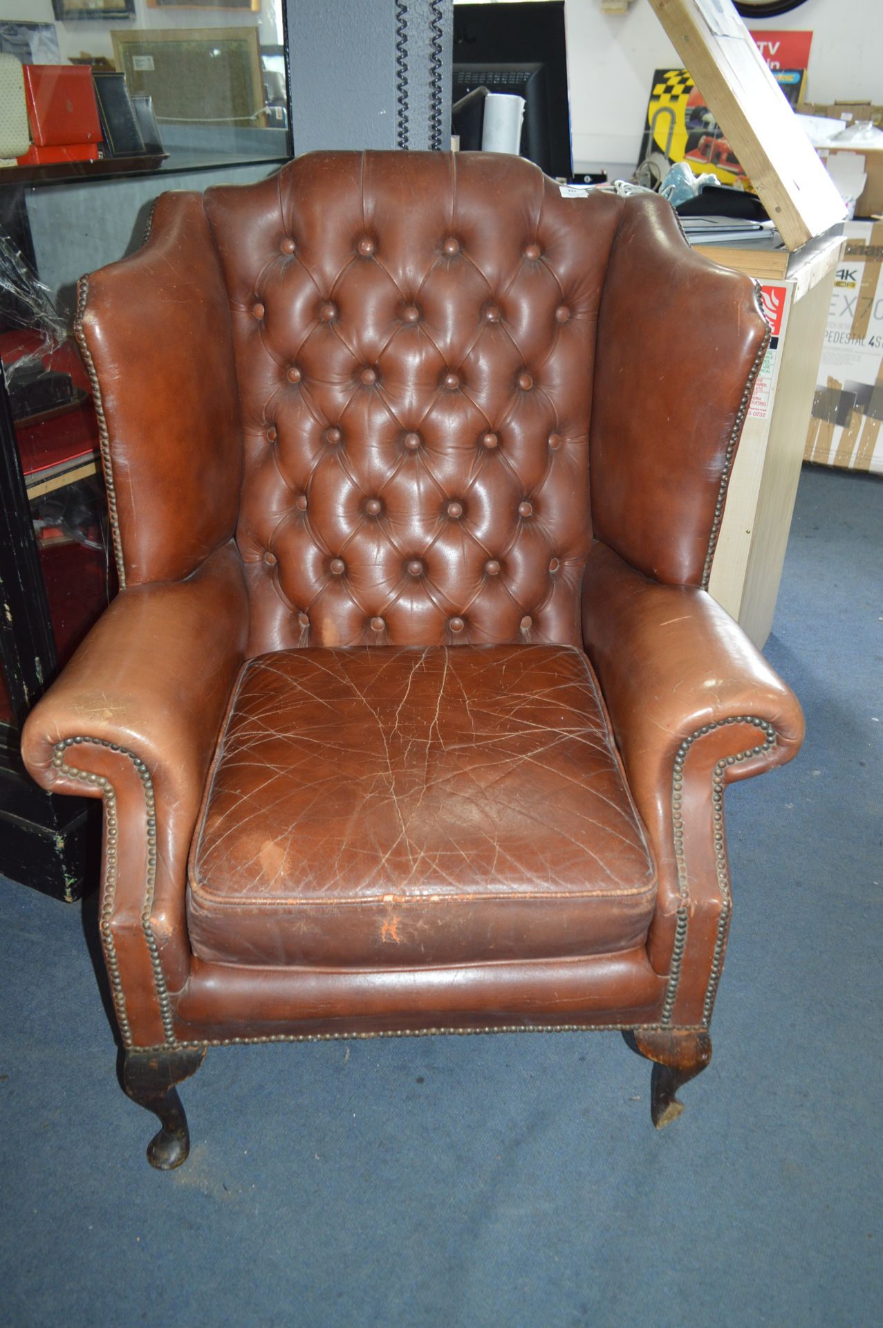 Brown Leather Winged Highback Armchair on Cabriole