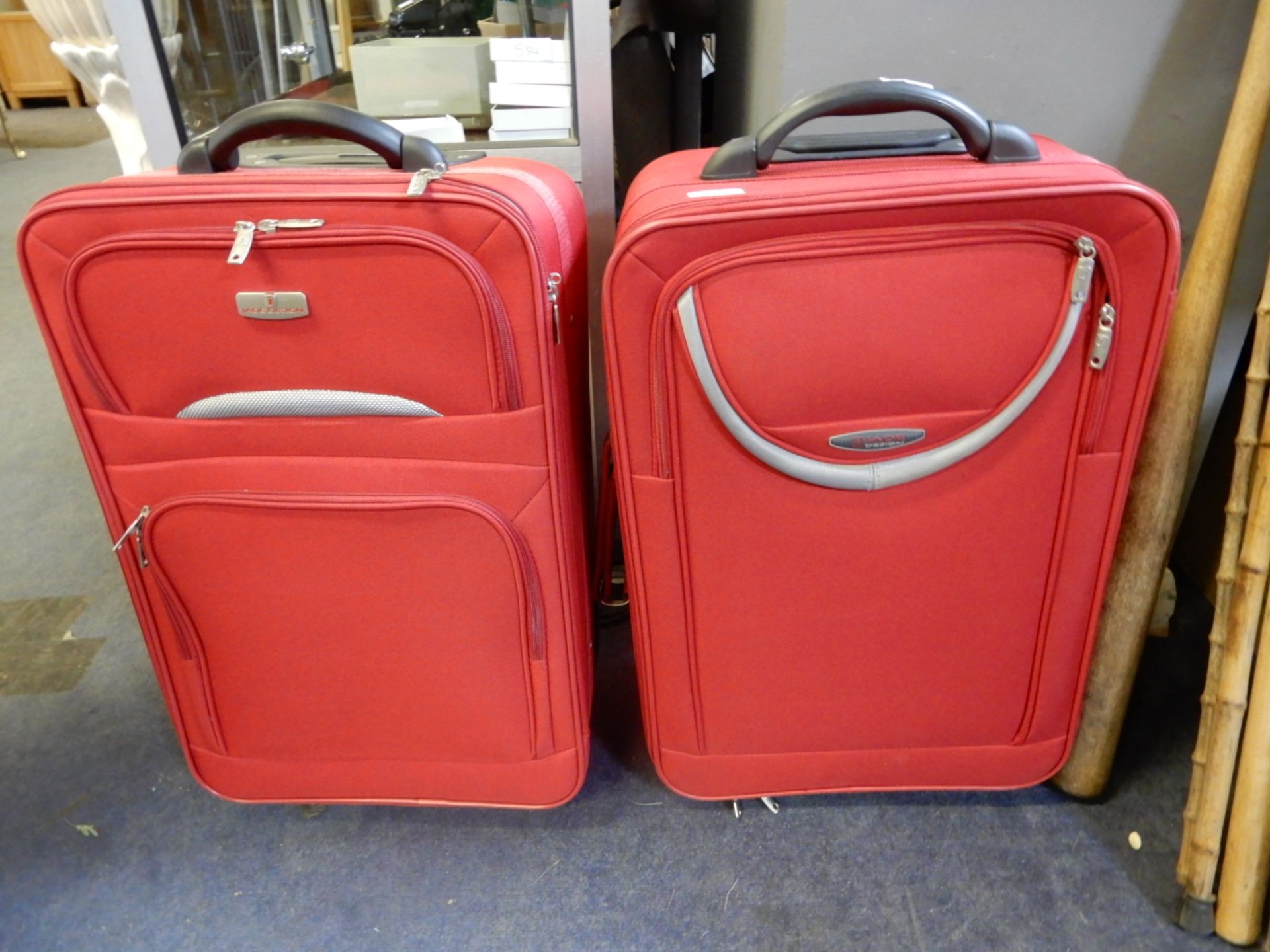 Two Red Wheeled Travel Cases