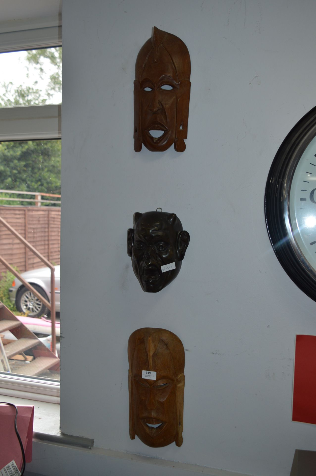 Two Carved Wood Wall Mask and a Pottery Wall Mask