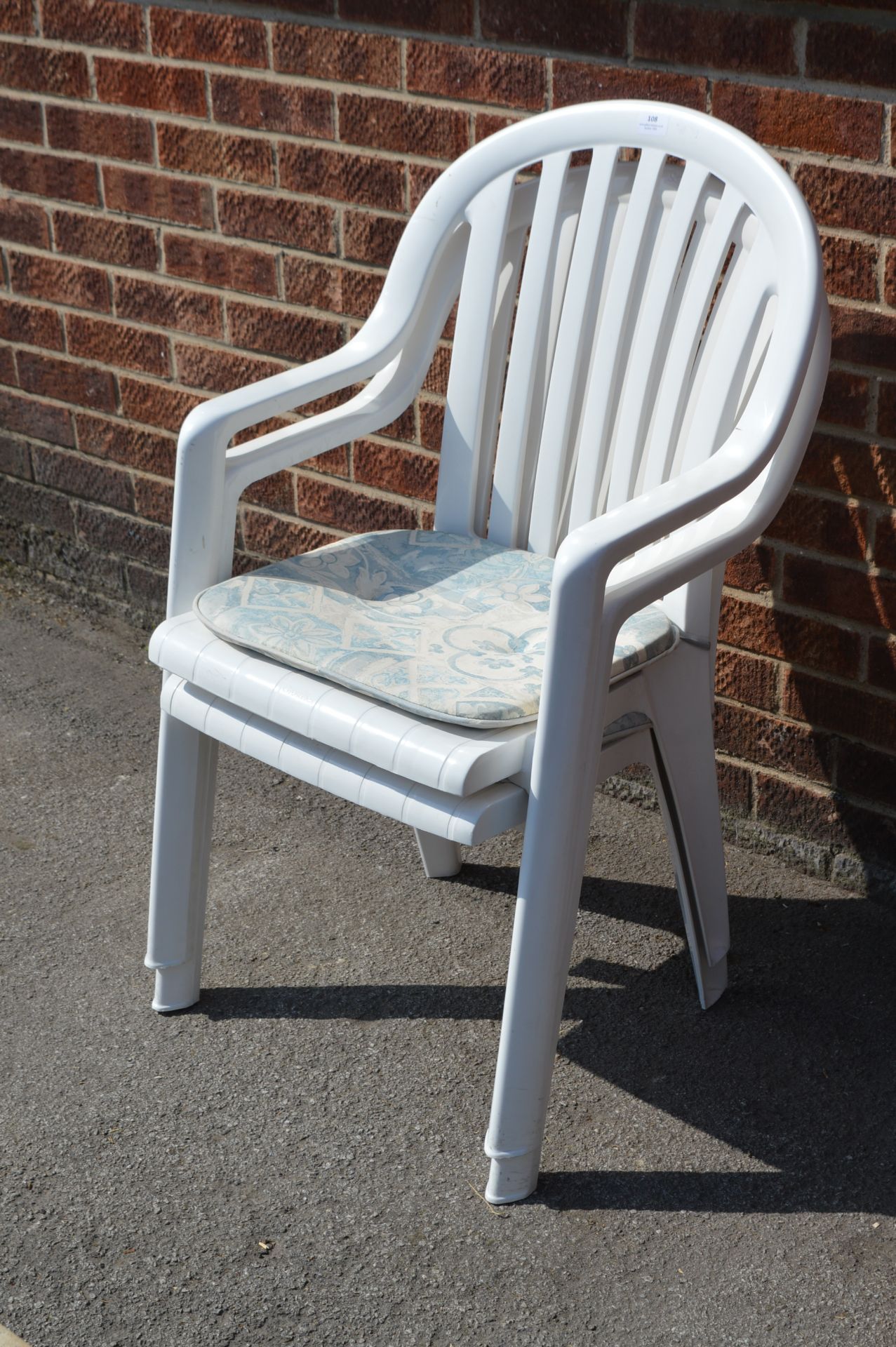 Two White Plastic Garden Chairs