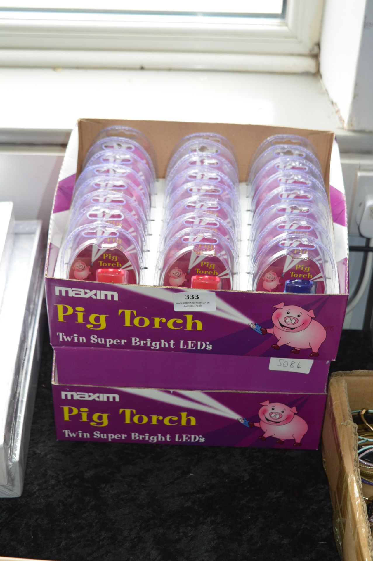 Two Boxes of 24 Maxim Pig Torch Keyrings