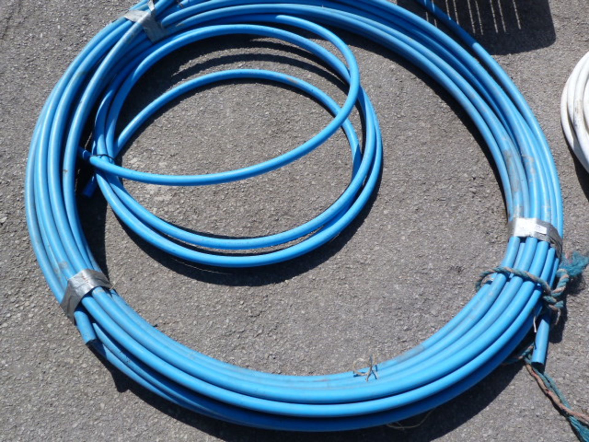 Two Coils of 25x2.3mm Plastic Piping