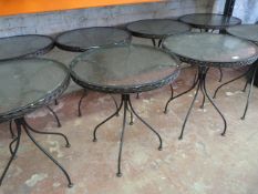 *Eight Glass Topped Circular Metal Tables