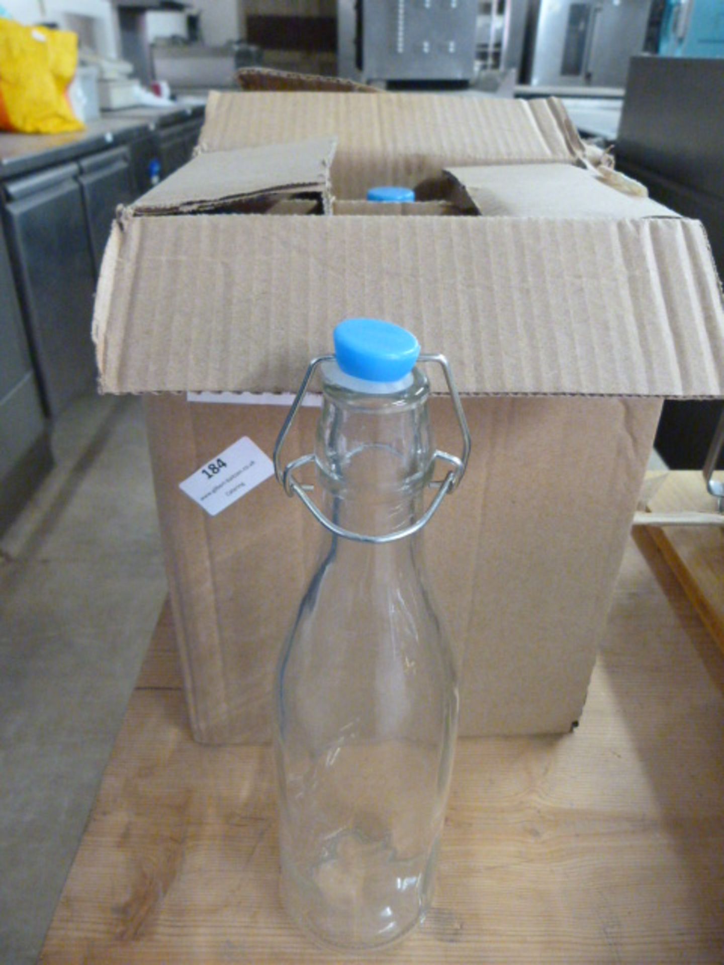 *Two Boxes Containing 12 Glass Bottles with Stoppe