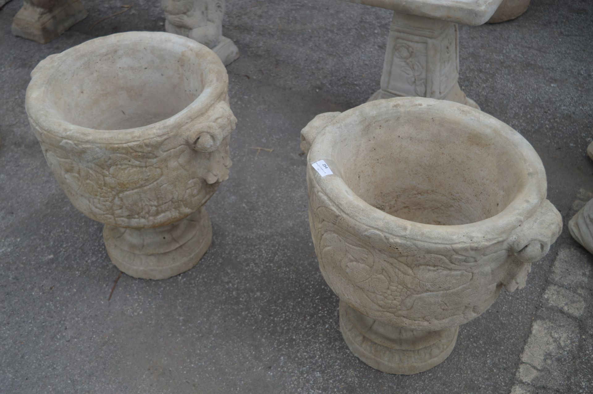 Pair of Reconstituted Limestone Garden Urns with B