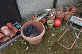 Clay Pots and a Fertaliser Spreader