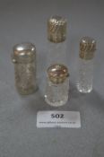 Three Silver Topped and One Silver Cased Glass Scent Bottle