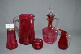 Cranberry Glassware, Decanter, Jugs, Sugar Sifter and a Small Vase