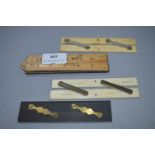 Two Ivory, One Ebony and One Boxwood Parallel Rulers and a Boxwood Folding Ruler