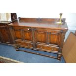 Oak Sideboard with Paneled Doors and Carved Borders
