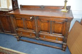 Oak Sideboard with Paneled Doors and Carved Borders