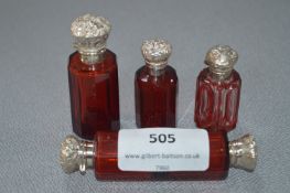 Four White Metal Topped Ruby Glass Scent Bottles