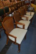 *Set of Four Walnut Armchairs with Bergere Panel Backs