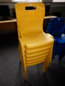 *Six Stackable Yellow Plastic Chairs