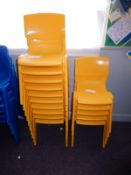 *Fifteen Stackable Yellow Plastic Chairs