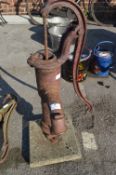 Cast Iron Water Pump on Concrete Base
