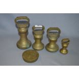 Set of Four Brass Bell Weights and One Other Weight