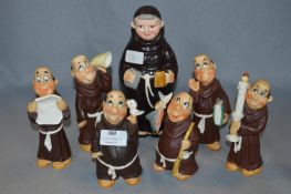 Collection of Pottery Monk Figurines and a Decanter