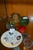 Two Homemaker Saucers and Four Glass Paperweights