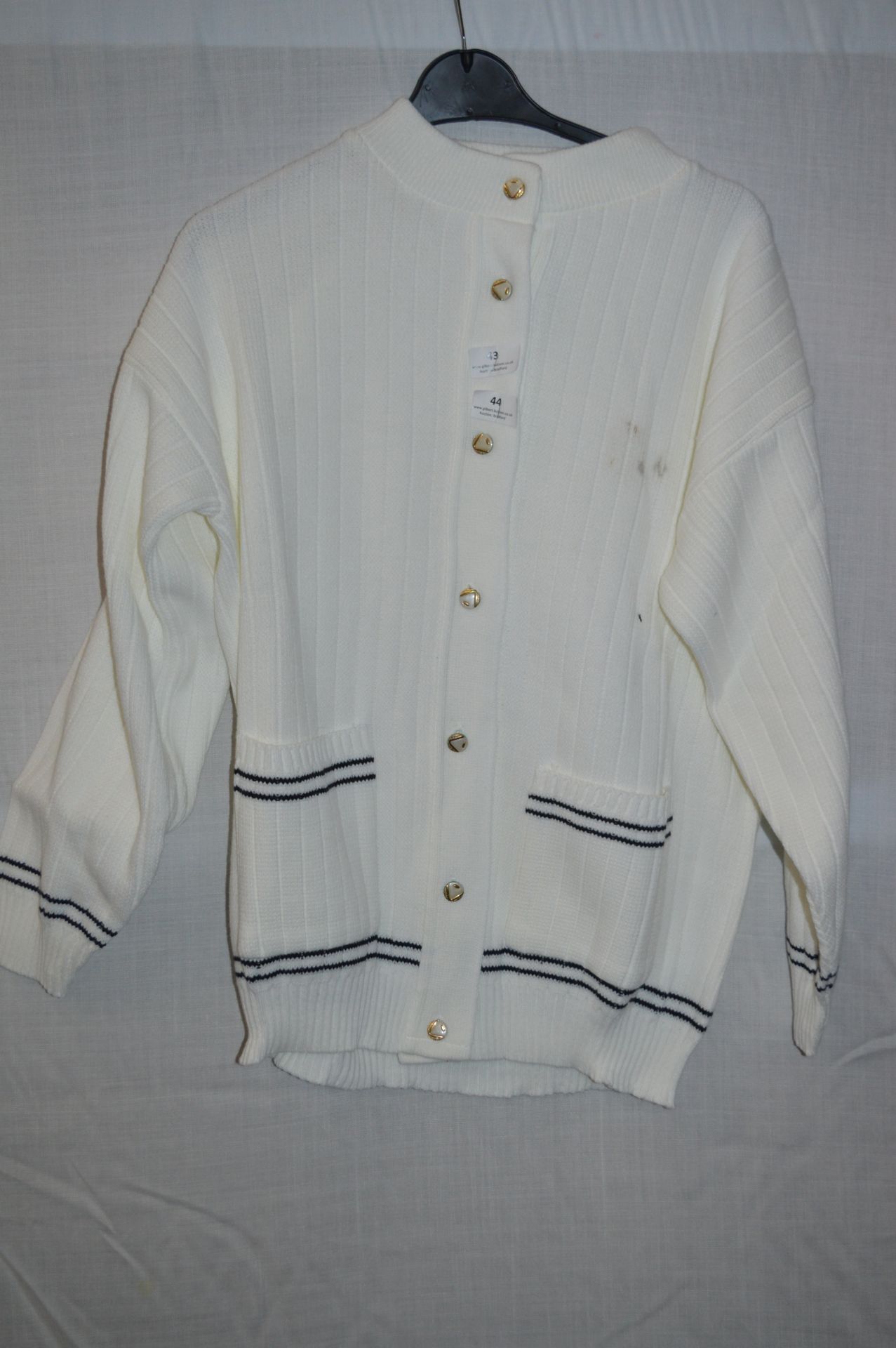 Box of Five White Knitted Cardigans with Blue Trim