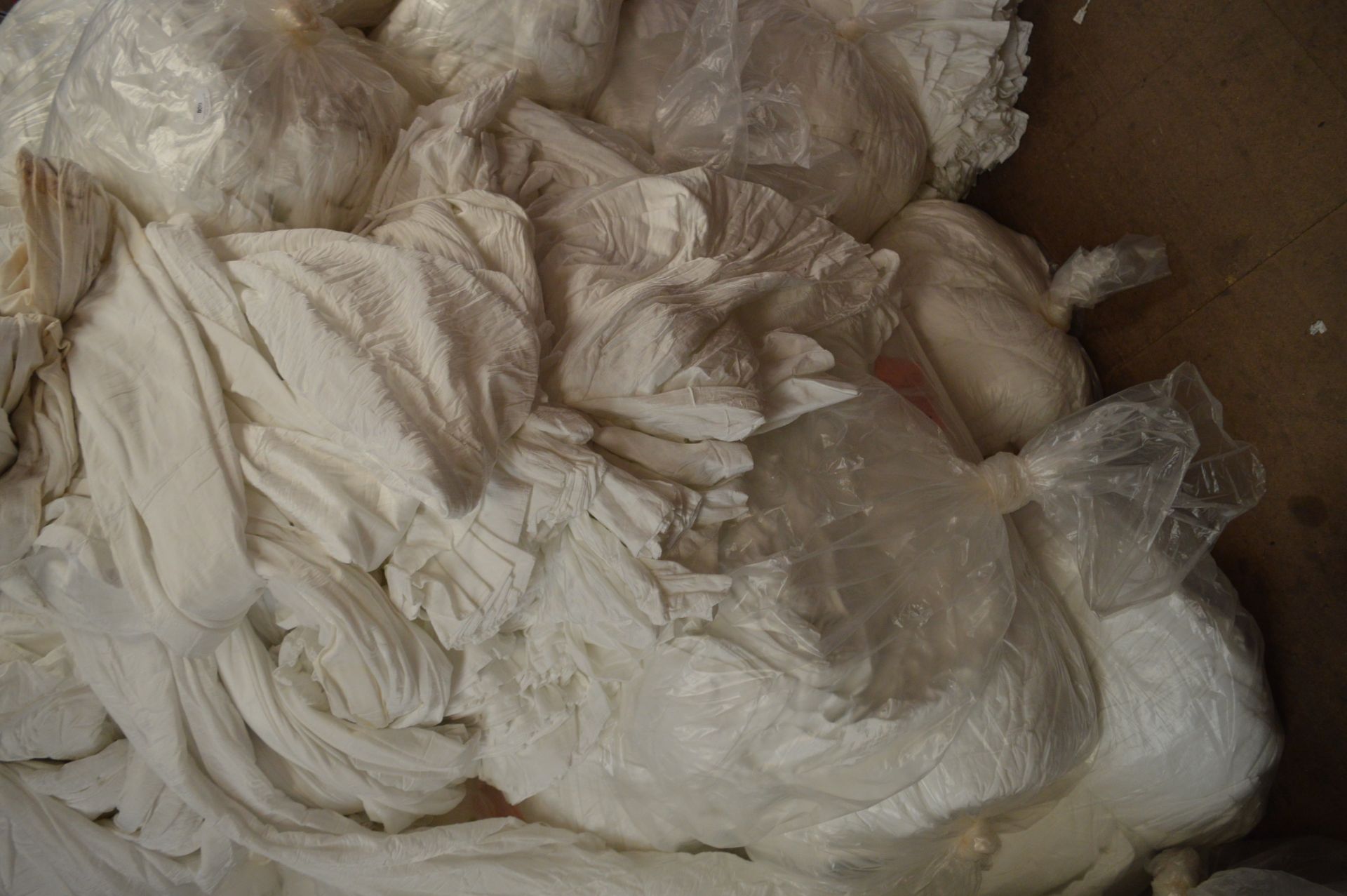 Ten Bags of White Stretch Fabric