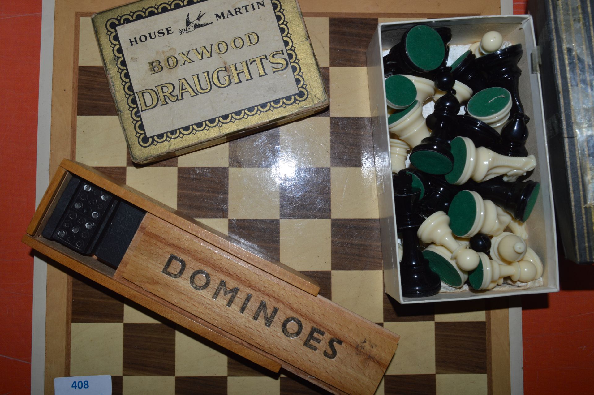 Chessboard with Chess PIeces, Draughts and Dominoe