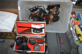 Box of Cameras and Camera Bags