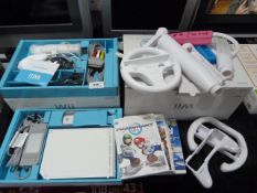 Nintendo Wii with Remotes, Accessories and Five Ga