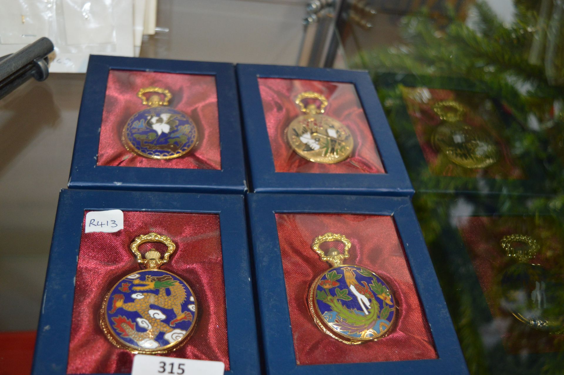 Four Enameled Gilt Metal Pocket Watches